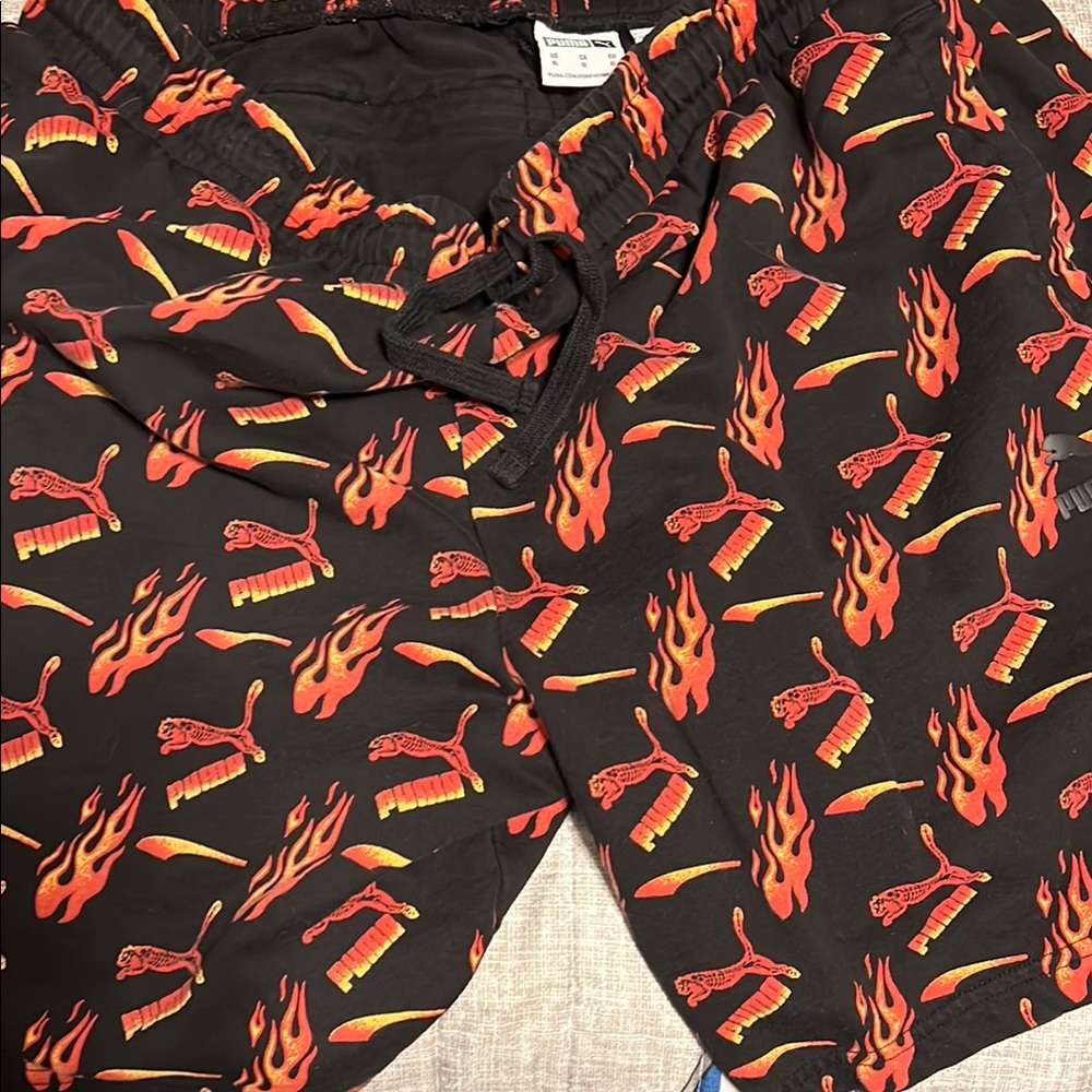 Puma Kids Black Shorts with Red and Yellow Flame Design